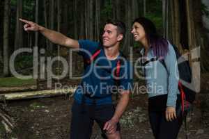 Hiker couple pointing at distance