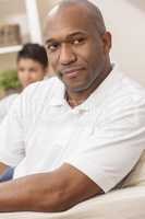 Handsome African American Man Woman Couple Sitting At Home