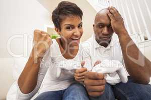 African American Couple Having Fun Playing Video Console Game