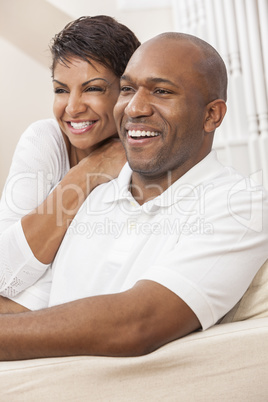 Happy African American Woman Couple Sitting At Home