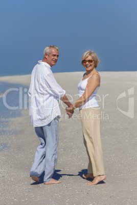 Happy Senior Couple Walking Holding Hands Tropical Beach