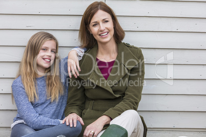 Happy Woman and girl Mother Daughter Smiling