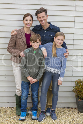 Happy Family Mother Father Son Daughter Outside