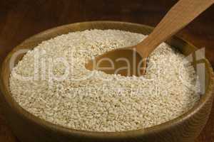 Sesame seeds in a wooden bowl