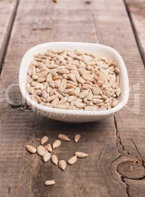 Sunflower seeds in a white bowl