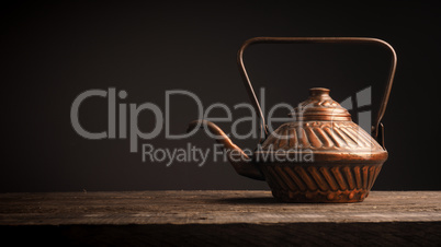 Old used copper tea pot