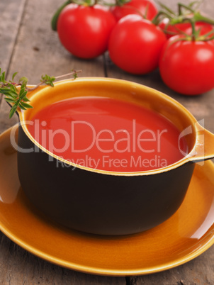 Gazpacho in a rustic bowl on a wooden table