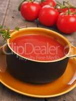 Gazpacho in a rustic bowl on a wooden table