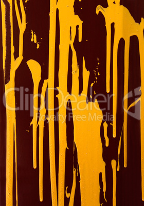 Yellow paint on a dark background