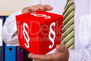 Man holds cubes with paragraph signs