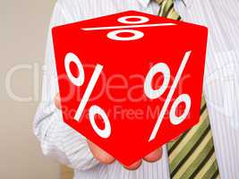 Man holds cubes with percent sign