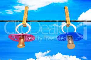 Baby pacifier hanging on the clothesline, 3d illustration