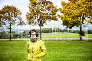 Woman with walk in autumnal scenery