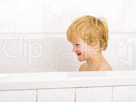 Child sits in the bath