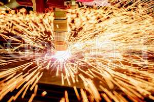 CNC Laser plasma cutting of metal, modern industrial technology.