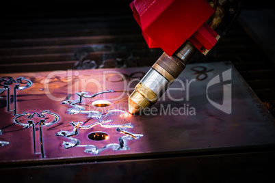 CNC Laser plasma cutting of metal, modern industrial technology.