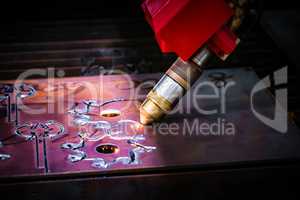 CNC Laser plasma cutting of metal, modern industrial technology.