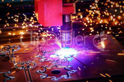 CNC Laser plasma cutting of metal, modern industrial technology.