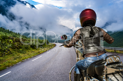 Biker girl First-person view, mountain serpentine.