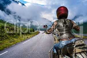 Biker girl First-person view, mountain serpentine.