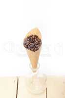 espresso coffee beans on a paper cone