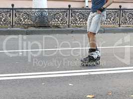 guy rides on roller skates on the road