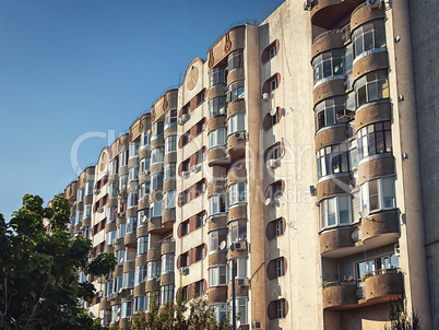 old multi-storey apartment building with balconies