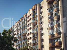 old multi-storey apartment building with balconies