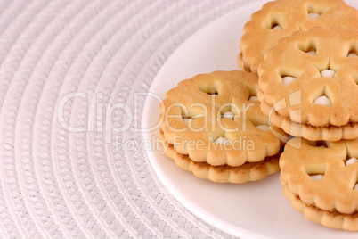 cookies stacked up on a plate, ready to be served.