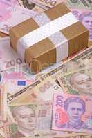 banknotes, clear image of dollars and new bills Ukrainian national currency hryvnia with gift box