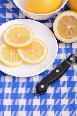 A slices of fresh yellow lemon. Lemon pieces in different sizes background