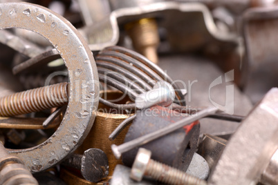 Stainless bolts and nuts on metallic background construction con