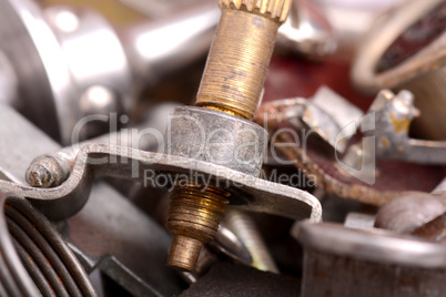 Stainless bolts and nuts on metallic background construction con