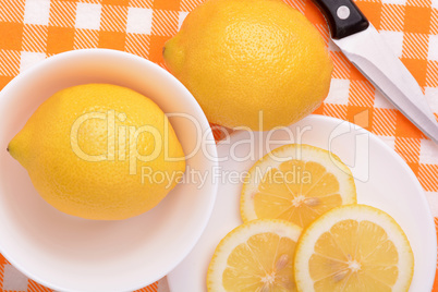 A slices of fresh yellow lemon. Lemon pieces in different sizes