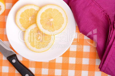 A slices of fresh yellow lemon. Lemon pieces in different sizes