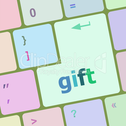 Computer keyboard with gift key - business background. Keyboard keys icon button