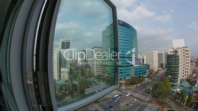 Timelapse of car traffic on city streets. Window view to Seoul in South Korea