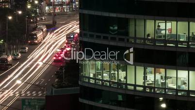 Timelapse of office life and city traffic at night. Seoul, South Korea