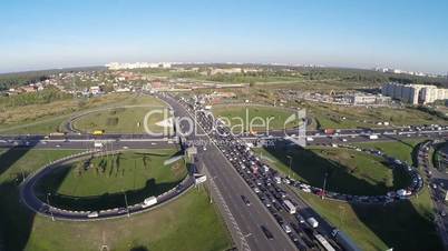 View from air of road interchange with city traffic