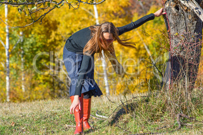 Young brunette on autumn mountain meadow