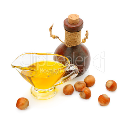 Oil and fruit hazelnut isolated on white background