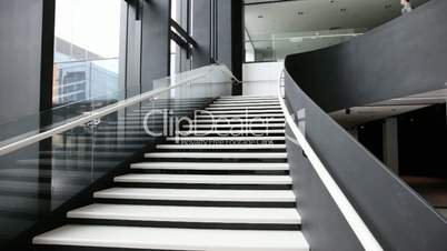 Business people walking down the stairs