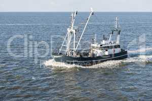 Fishing boat on Wadden Sea  .