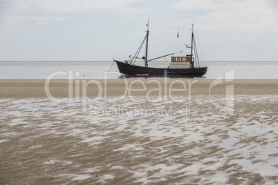 Fishing boat nearby the beach .