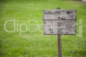 wooden board on grass