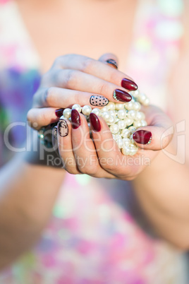 beautiful women's hands holding pearl