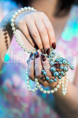 beautiful women's hands holding pearl