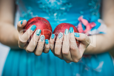 Hands with Nails Holding Peaches