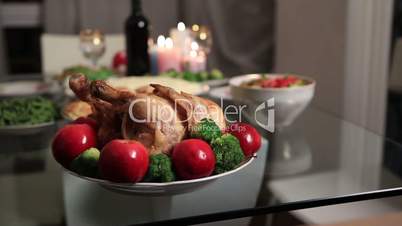 Multi generation family serving Thanksgiving table