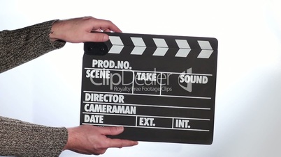 Close up of male hand holding movie clapperboard